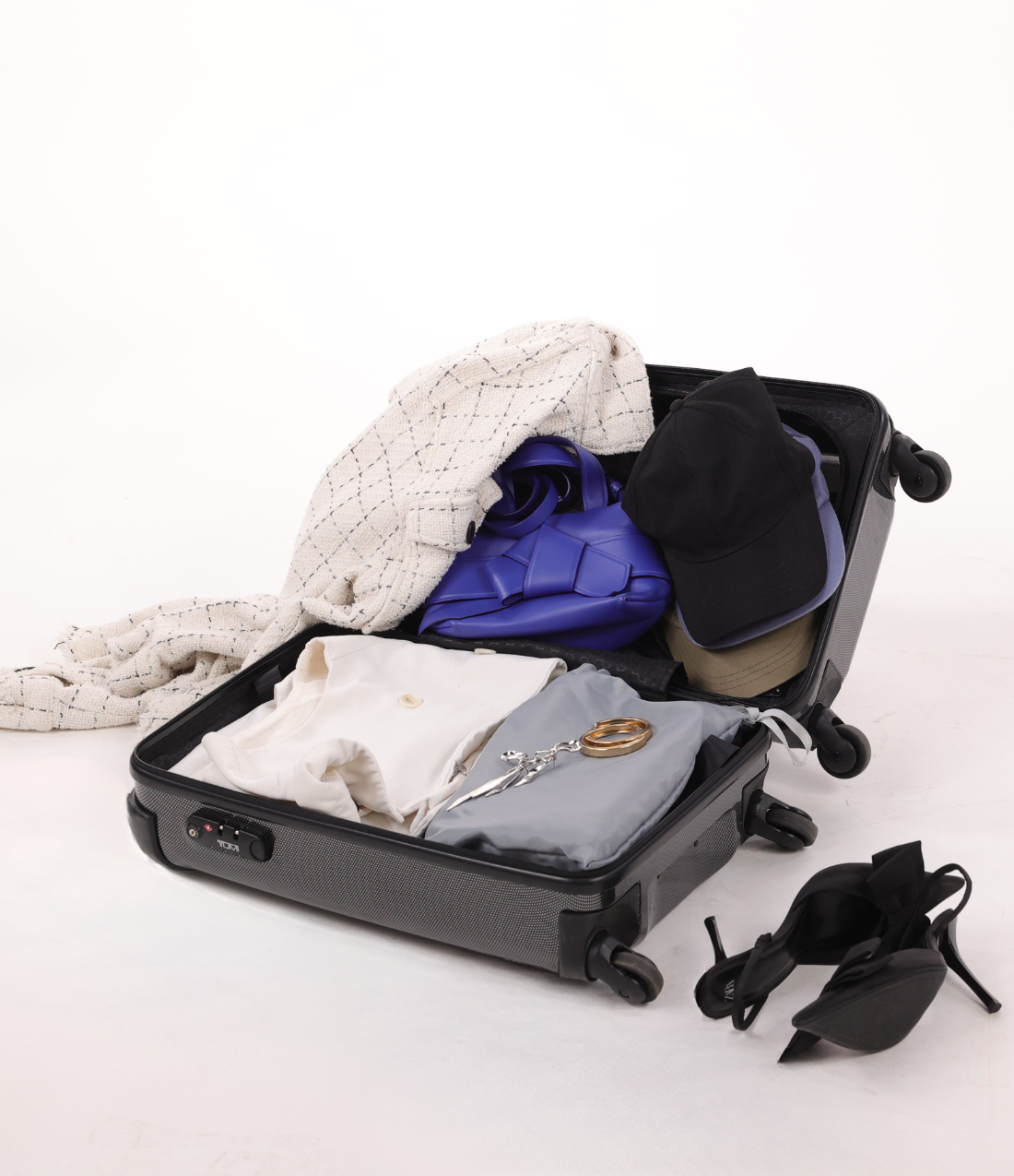Packed suitcase and shoes ready for travel