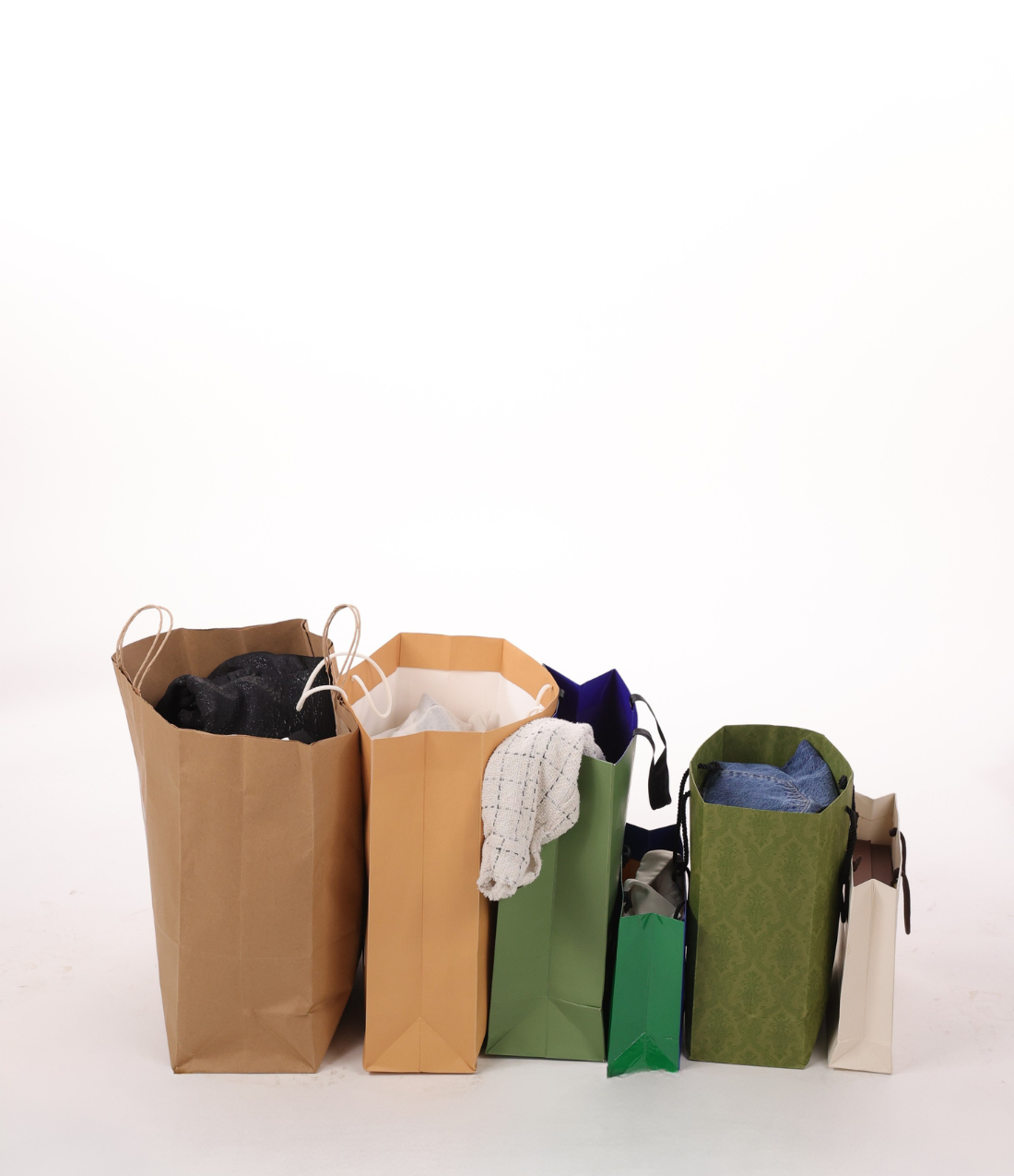 Shopping bags filled with new wardrobe pieces